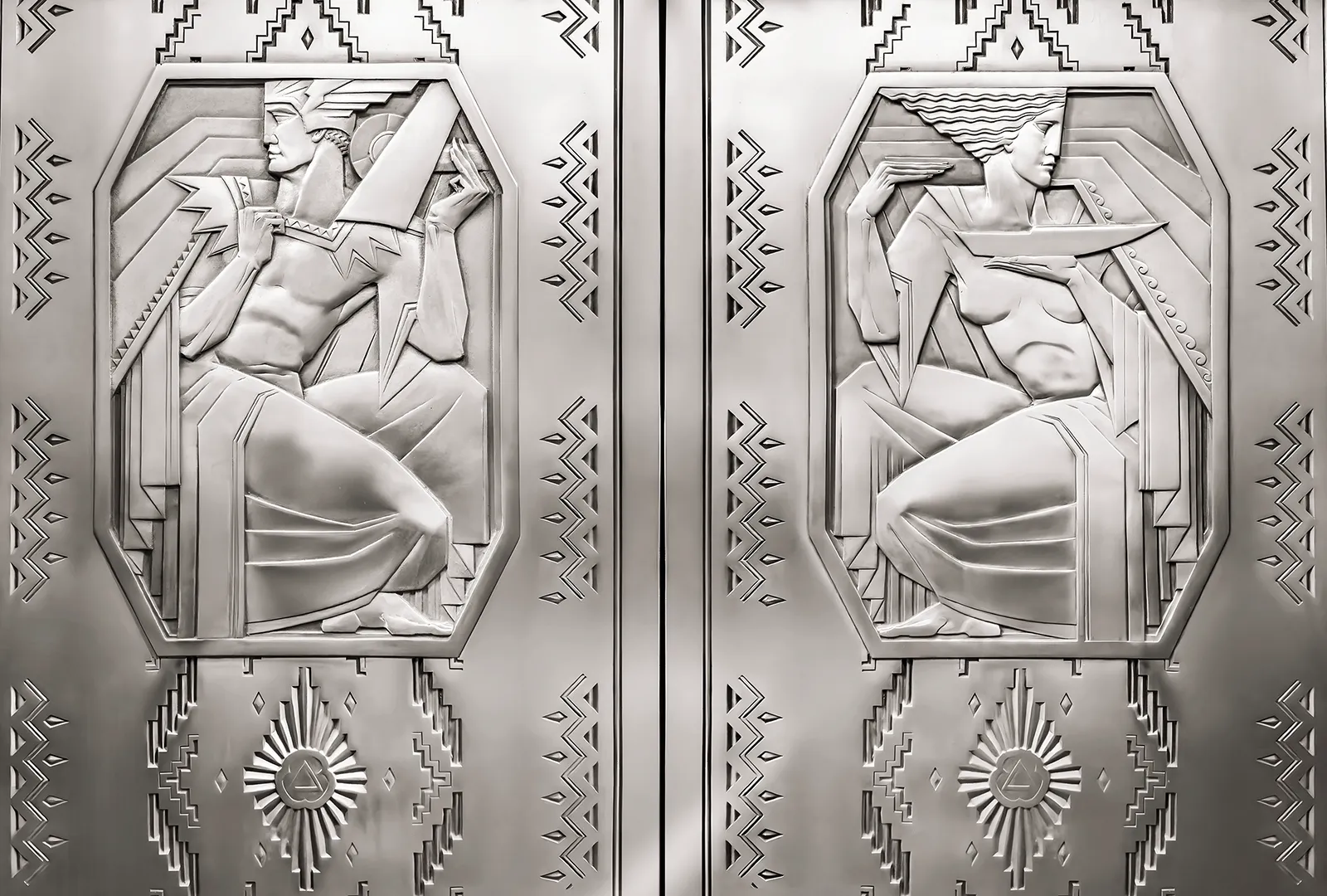 The elevator doors shows a pair of nickel-silver reliefs designed by Rene Paul Chambellan, representing the evolution of fuel.