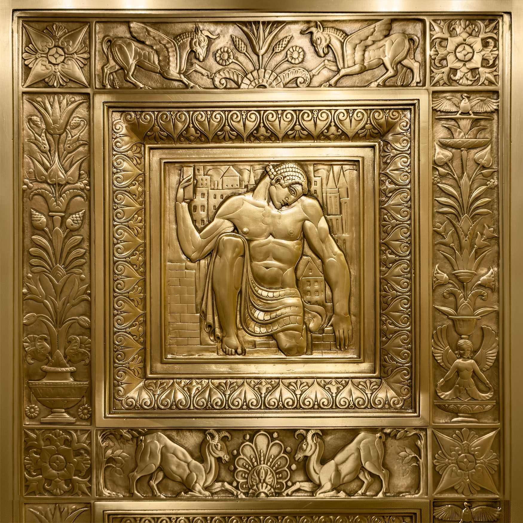 The Kneeling Builder Building-Construction Agitation. Gilded Bronze Radiator Grill in the vestibule of the Chanin Building. By Rene Paul Chambellan 1929.