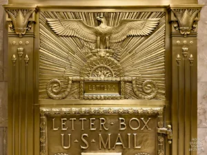 Gilded bronze mailbox, Fred French Building, New York, 1927. American eagle, Babylonian griffins, sunburst rays. Artwork by Vincent Glinsky, metalwork by Oscar Bach, program by Douglas Ives. Photographed by Roberto Bigano.
