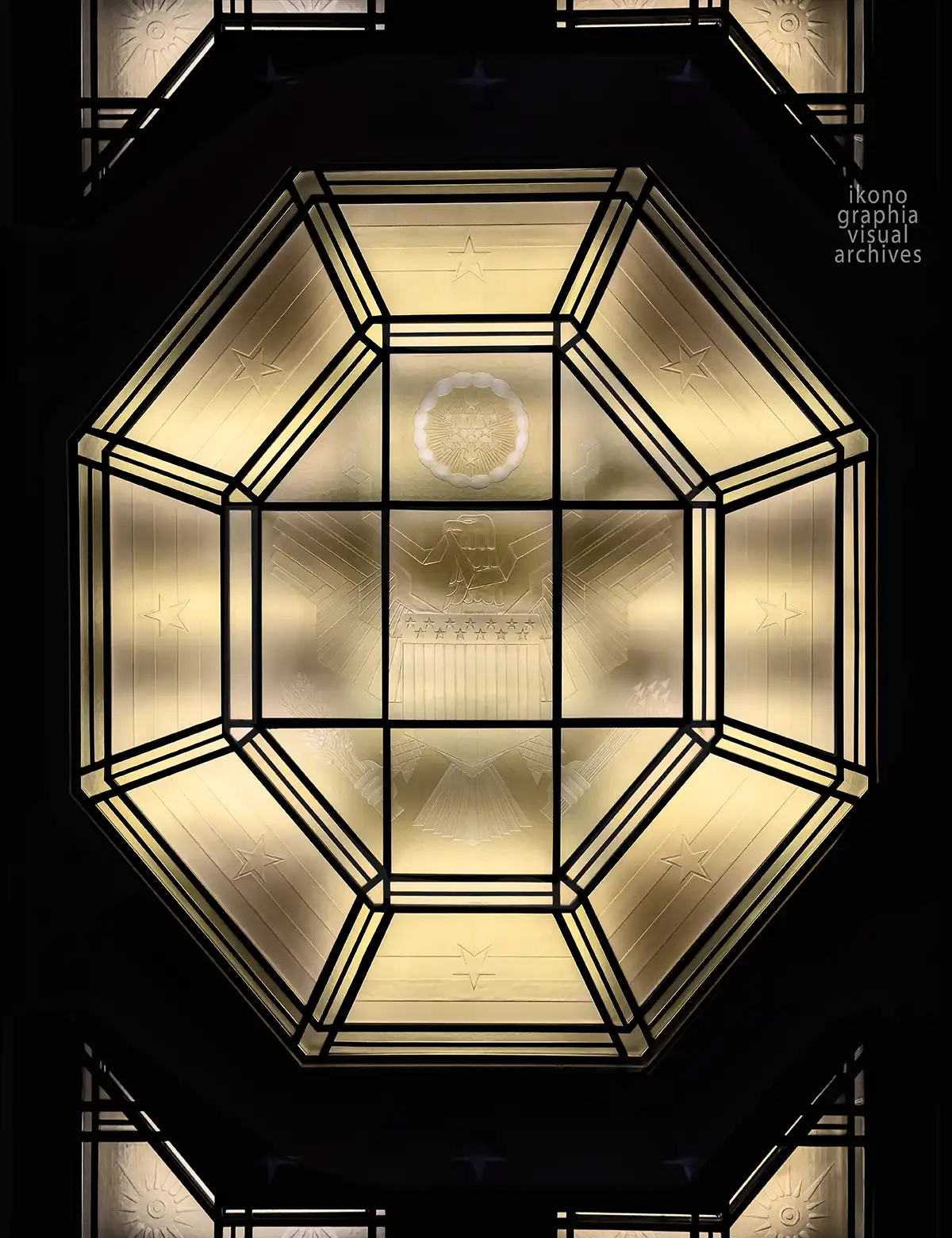 National Seal ceiling light, 90 Church Street, New York, 1937. Beveled crystal panels in bronze octagonal frame, reversible eagle by Carl Paul Jennewein. Photographed by Davide Bigano.